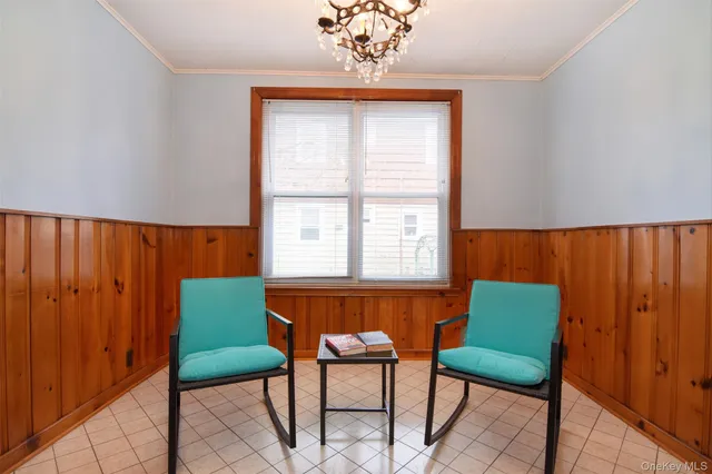 a room with a chair and a window