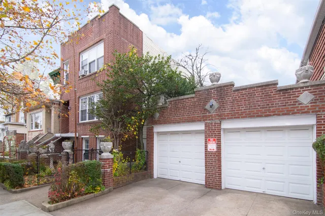a front view of a house with garage