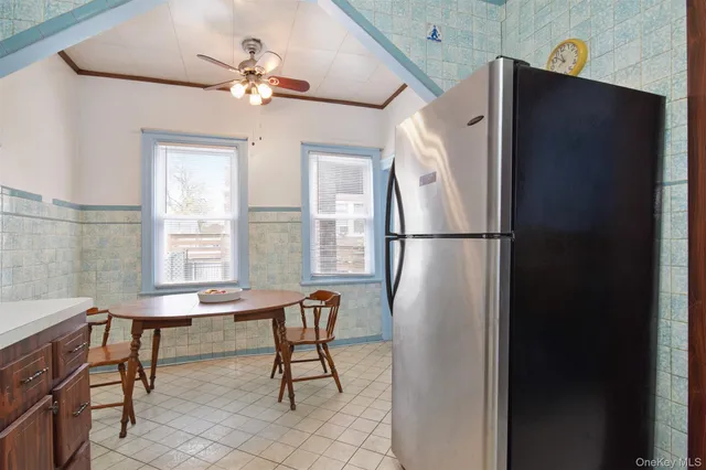 a dining room with furniture and window