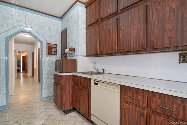 a kitchen with a sink and cabinets