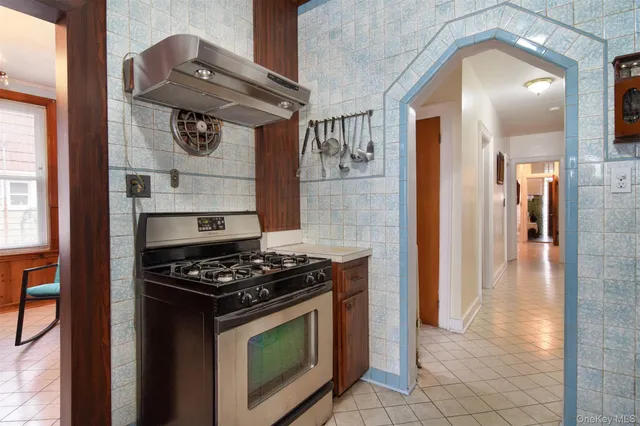 a kitchen with stainless steel appliances granite countertop a stove and a refrigerator