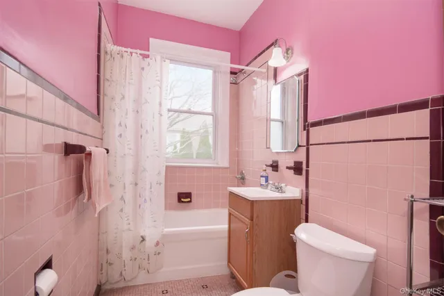 a bathroom with a sink toilet tub and shower
