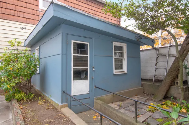 a backyard of a house with seating space