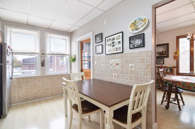 a view of a dining room with furniture and window