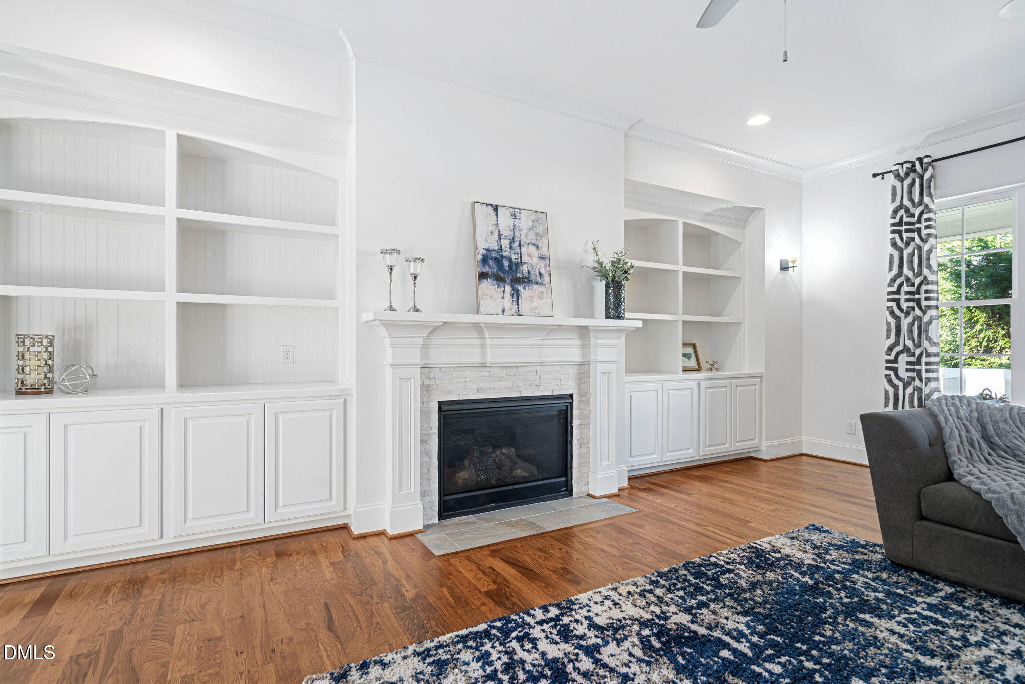 2414 Vetrina Way Apex, NC 27502 - Photo 17 of 60 a living room with furniture and a fireplace