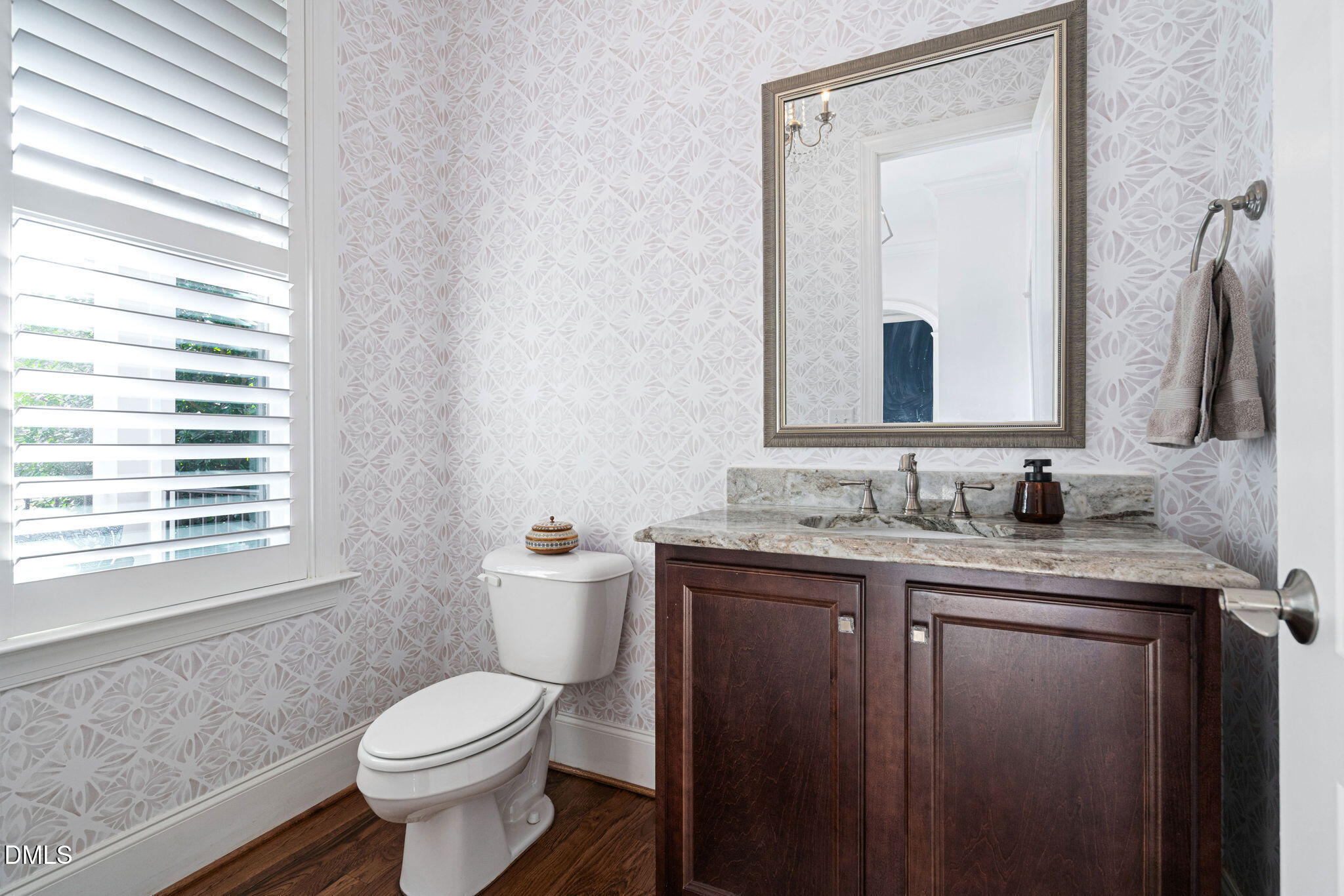 2414 Vetrina Way Apex, NC 27502 - Photo 19 of 60 a bathroom with a granite countertop sink toilet and mirror