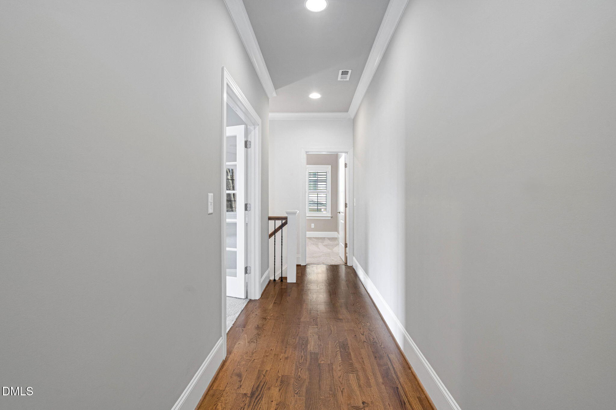 2414 Vetrina Way Apex, NC 27502 - Photo 28 of 60 a view of a hallway with wooden floor