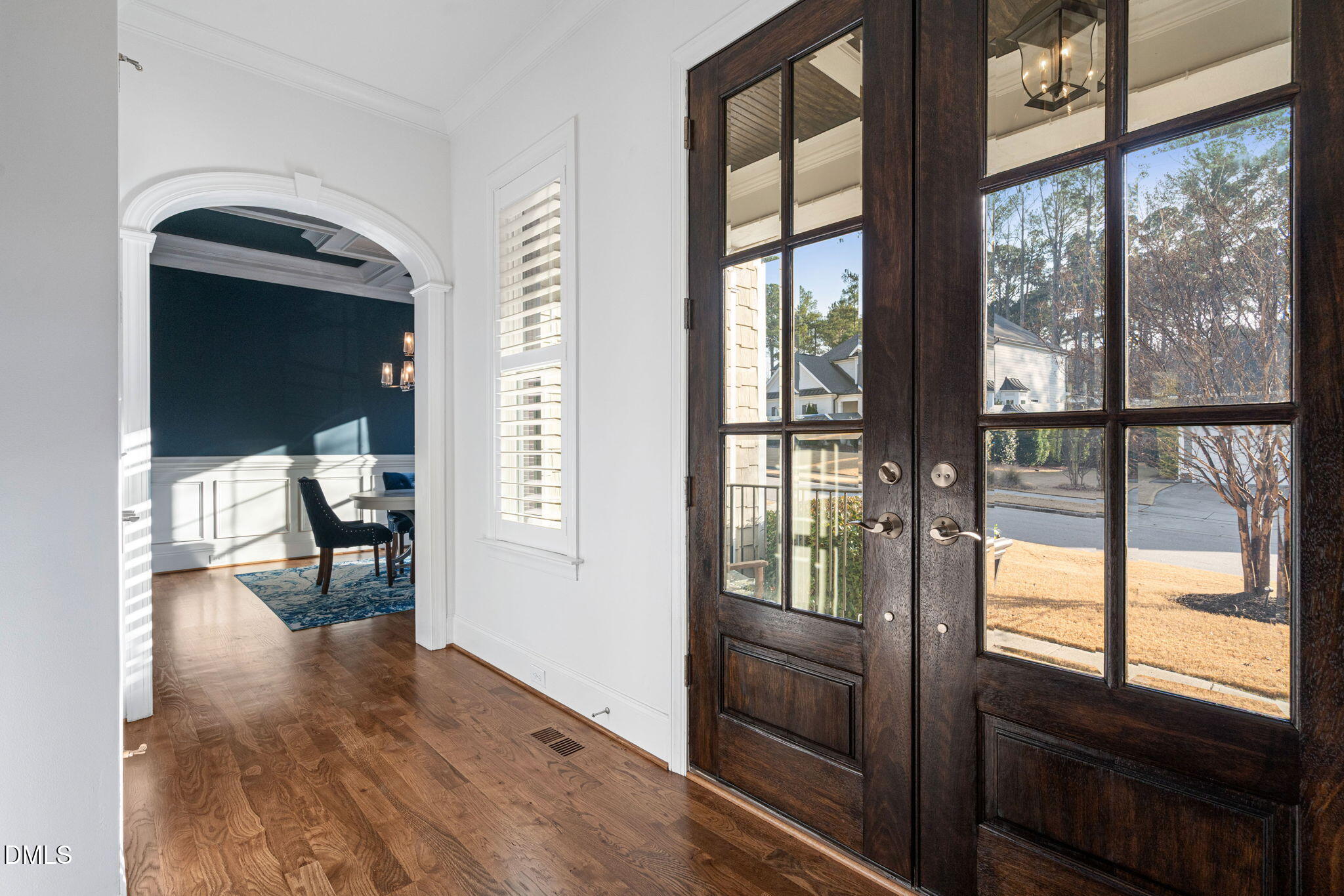 2414 Vetrina Way Apex, NC 27502 - Photo 3 of 60 a view of hallway with livingroom and wooden floor