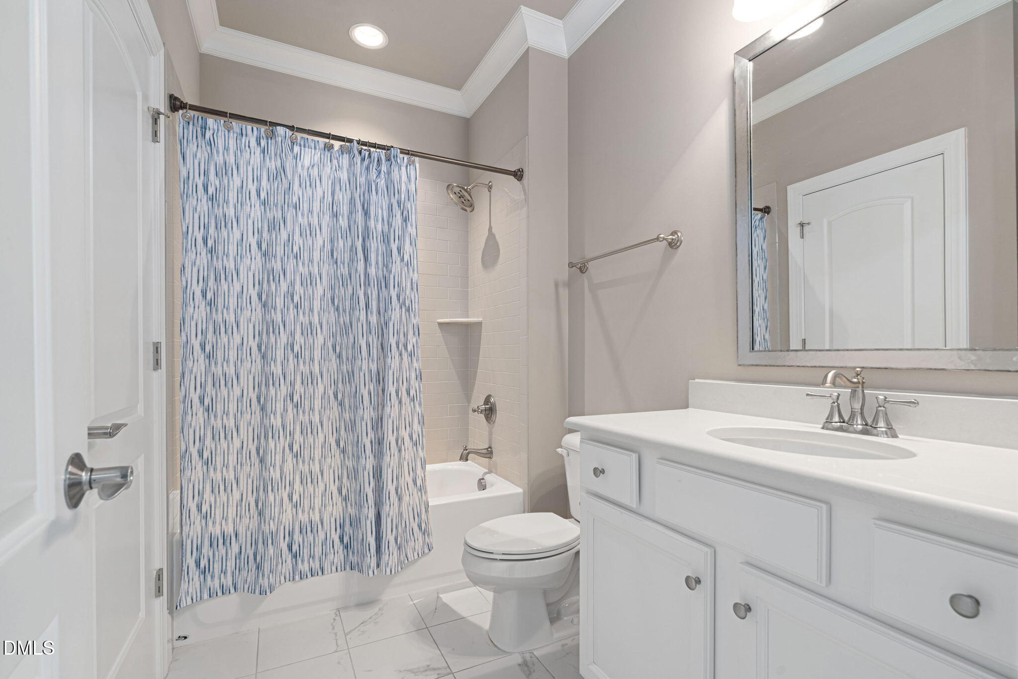 2414 Vetrina Way Apex, NC 27502 - Photo 33 of 60 a bathroom with a sink a toilet and shower