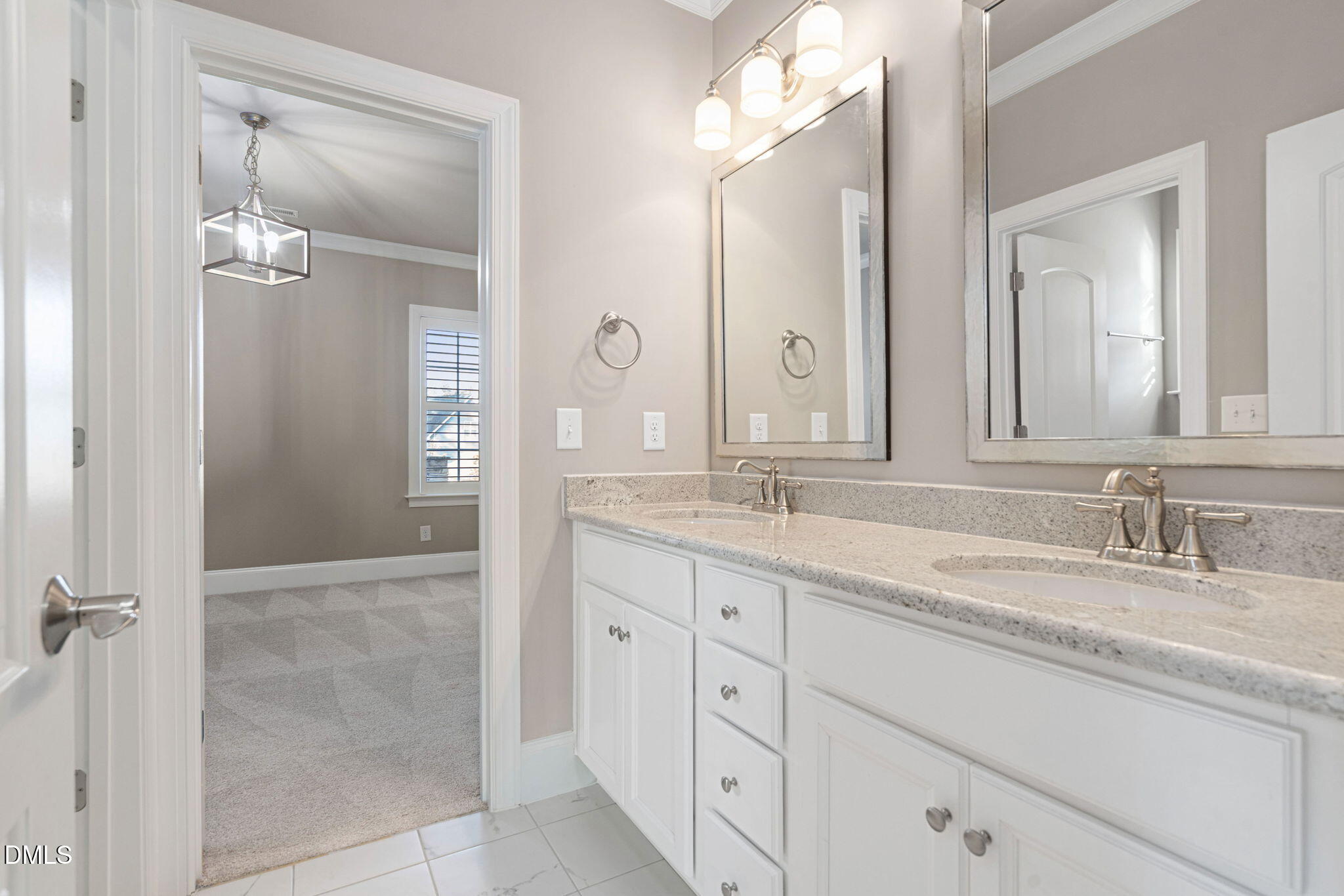 2414 Vetrina Way Apex, NC 27502 - Photo 40 of 60 a bathroom with a granite countertop sink mirror and double
