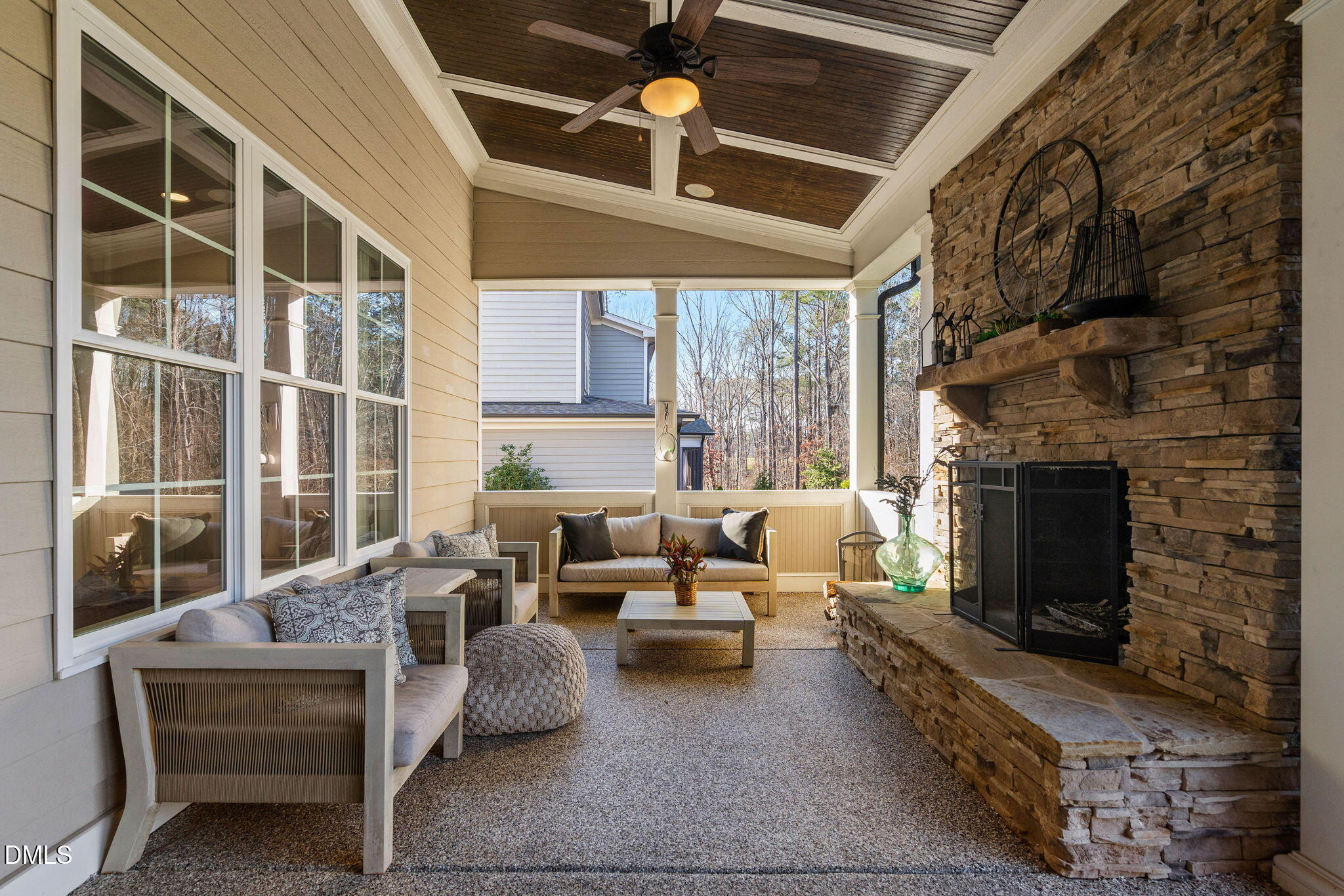 2414 Vetrina Way Apex, NC 27502 - Photo 49 of 60 a living room with furniture and a fireplace