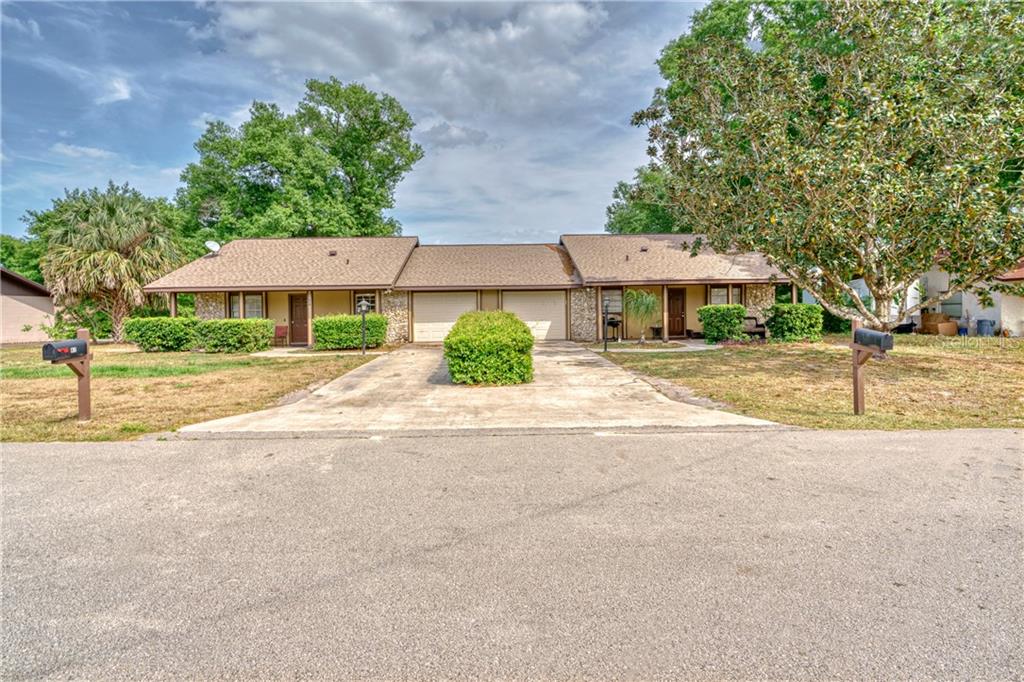 a house with yard in front of it
