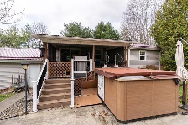 a view of a house with a backyard
