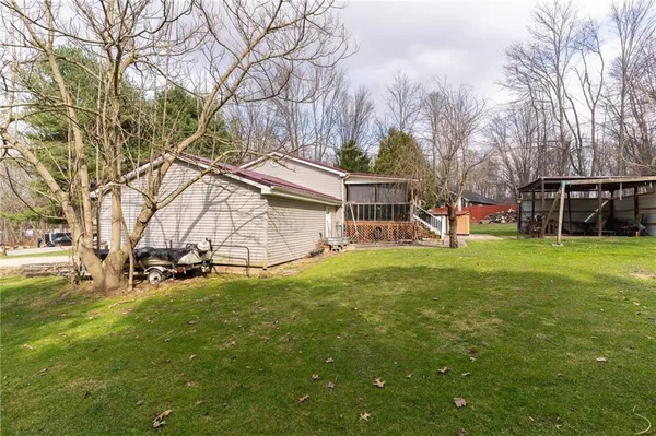 a view of a house with a yard