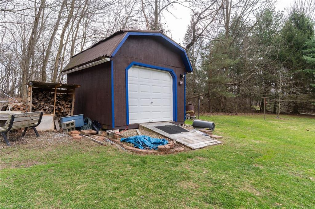 106 Willadell Road Transfer, PA 16154 - Photo 25 of 46 a backyard of a house with table and chairs