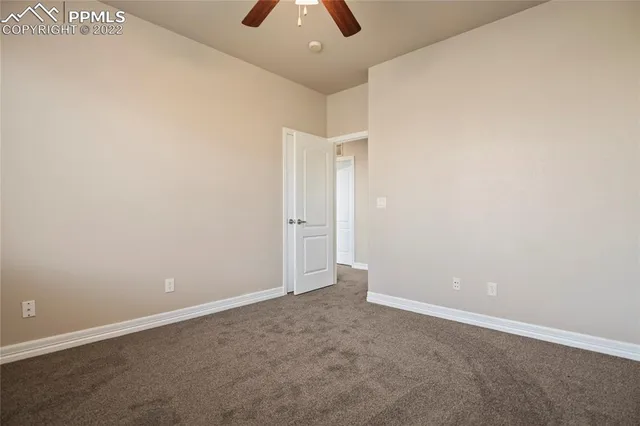 a view of a kitchen with stainless steel appliances granite countertop a sink and cabinets