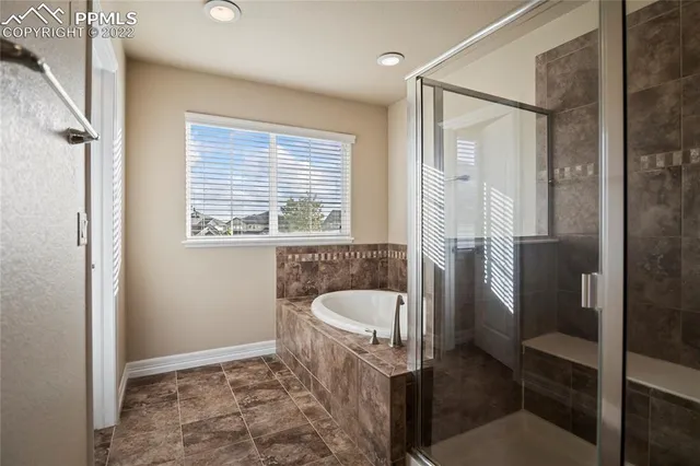 an aerial view of a house with yard swimming pool and outdoor seating