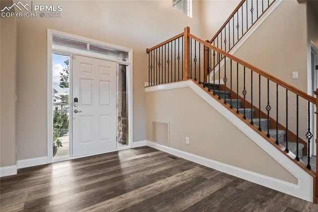 a kitchen with stainless steel appliances granite countertop a stove sink and cabinets