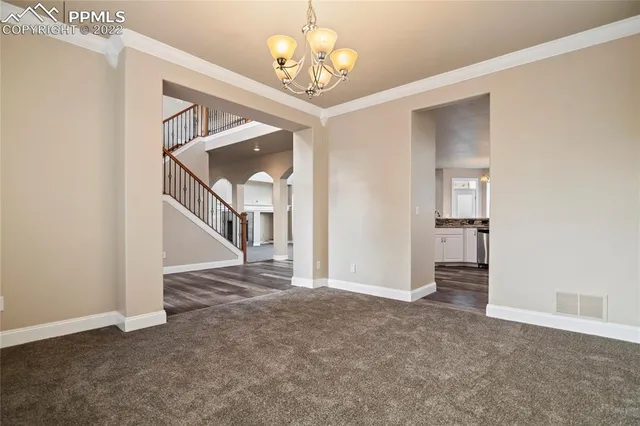 a kitchen with stainless steel appliances granite countertop a stove and a sink