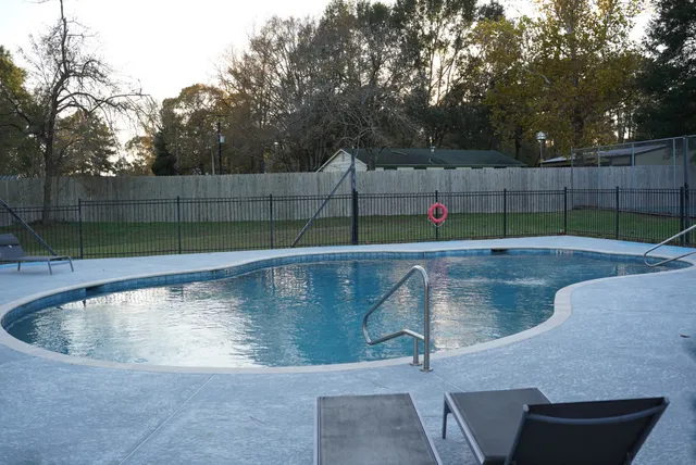 a view of outdoor space with swimming pool and seating