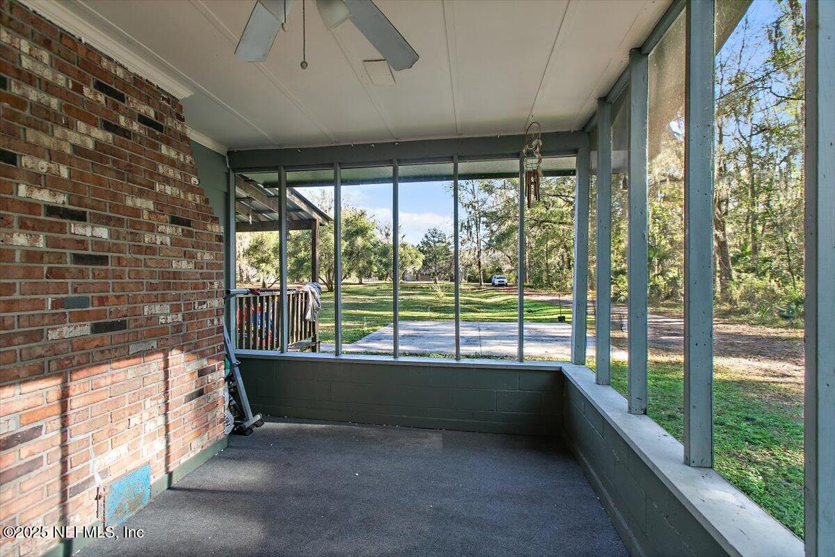45077 Clemmons Road Callahan, FL 32011 - Photo 14 of 20 a view of an empty room with a large window