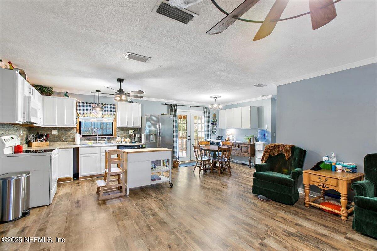 45077 Clemmons Road Callahan, FL 32011 - Photo 5 of 20 a living room with furniture and kitchen view