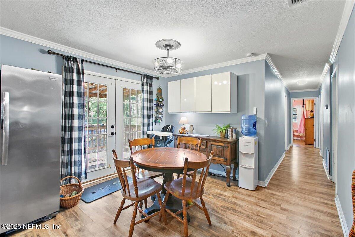 45077 Clemmons Road Callahan, FL 32011 - Photo 7 of 20 a view of a dining room with furniture window and wooden floor