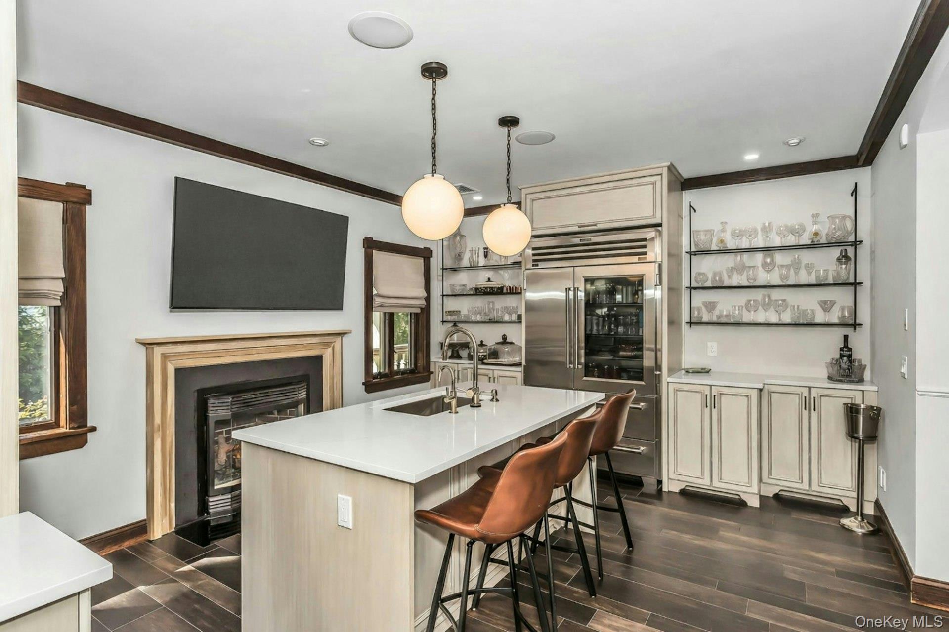 91 Crescent Beach Road Glen Cove, NY 11542 - Photo 13 of 38 a dining room with furniture a window and a fireplace