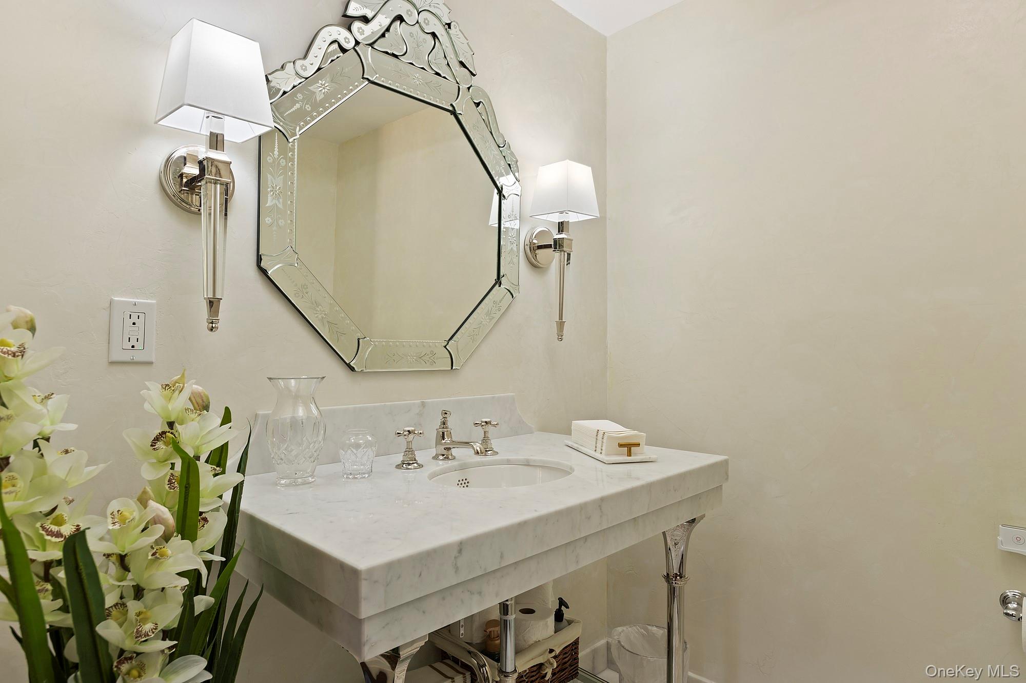 91 Crescent Beach Road Glen Cove, NY 11542 - Photo 14 of 38 a bathroom with a sink vanity and a mirror
