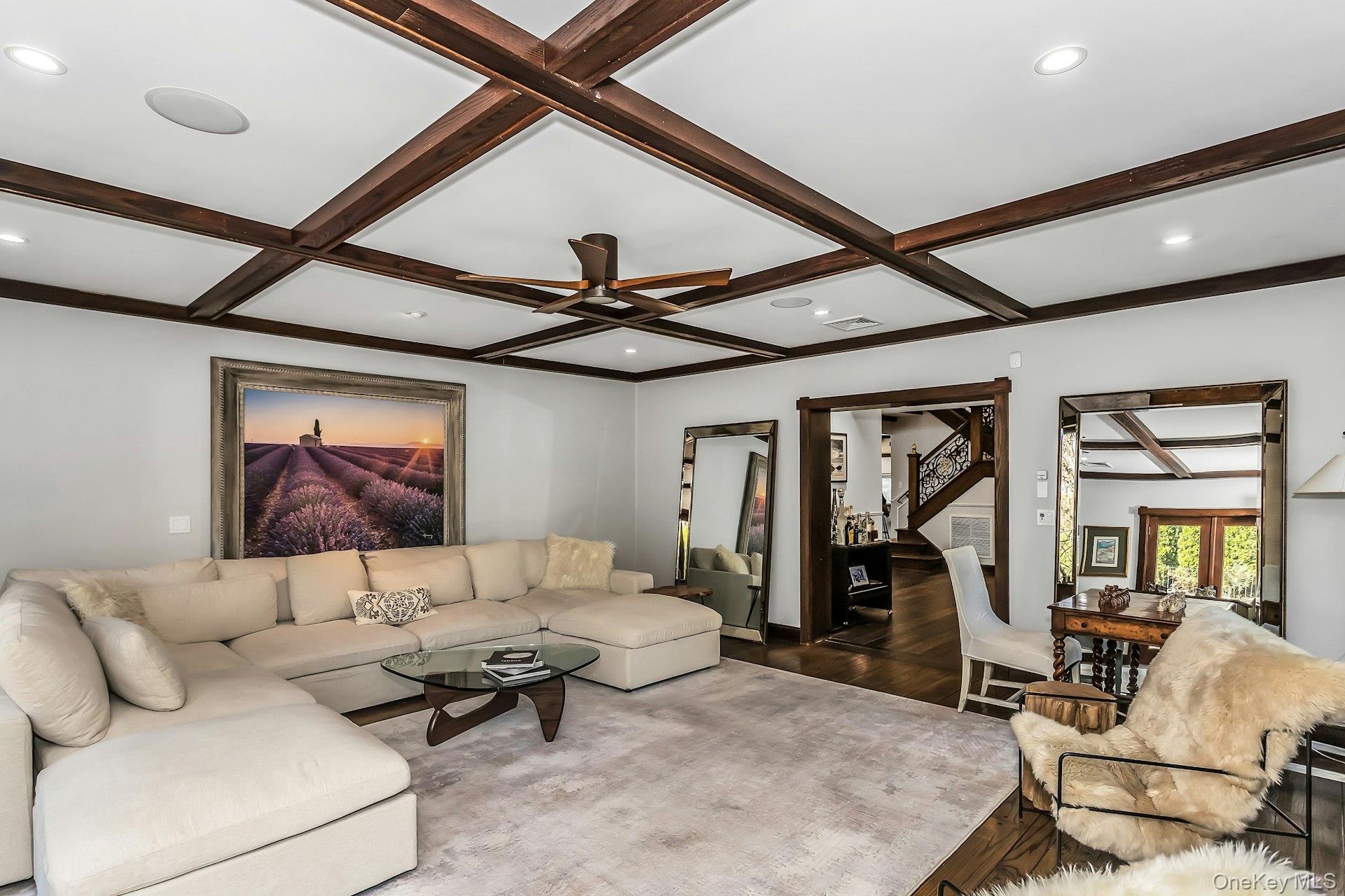 91 Crescent Beach Road Glen Cove, NY 11542 - Photo 17 of 38 a living room with furniture and a ceiling fan