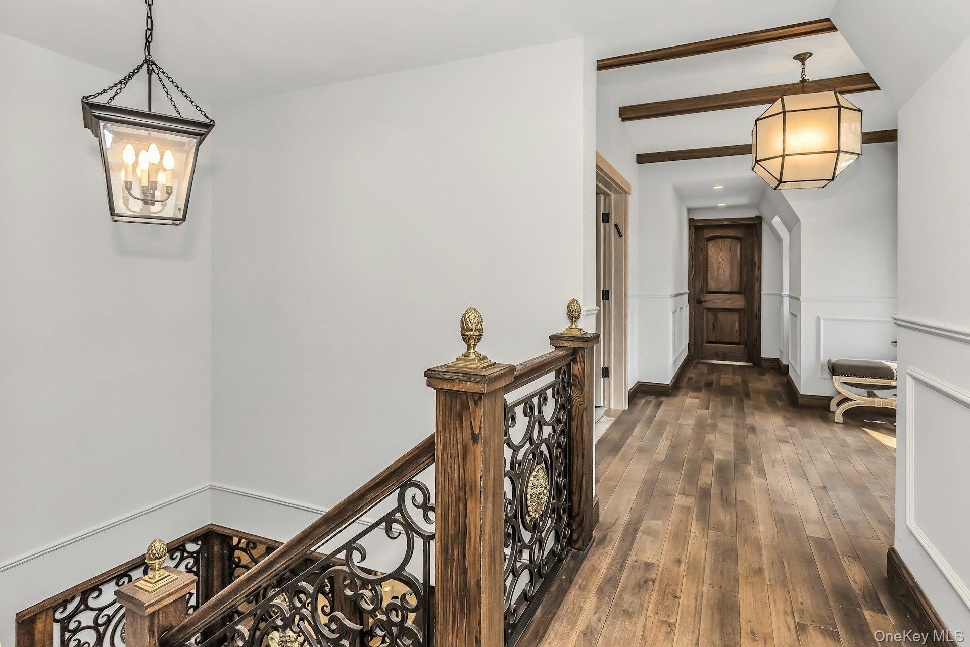 91 Crescent Beach Road Glen Cove, NY 11542 - Photo 19 of 38 a view of a hallway with wooden floor and staircase