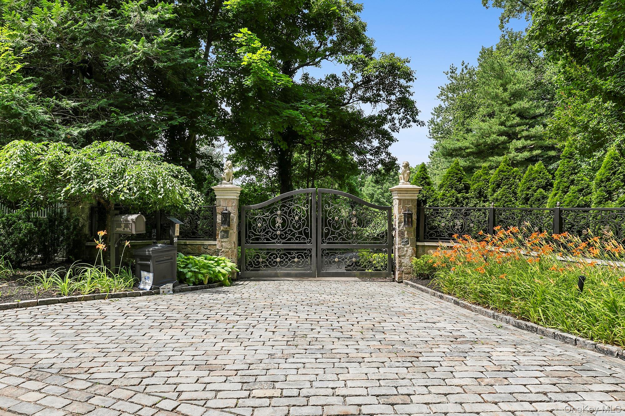 91 Crescent Beach Road Glen Cove, NY 11542 - Photo 2 of 38 a backyard of a house with lots of green space