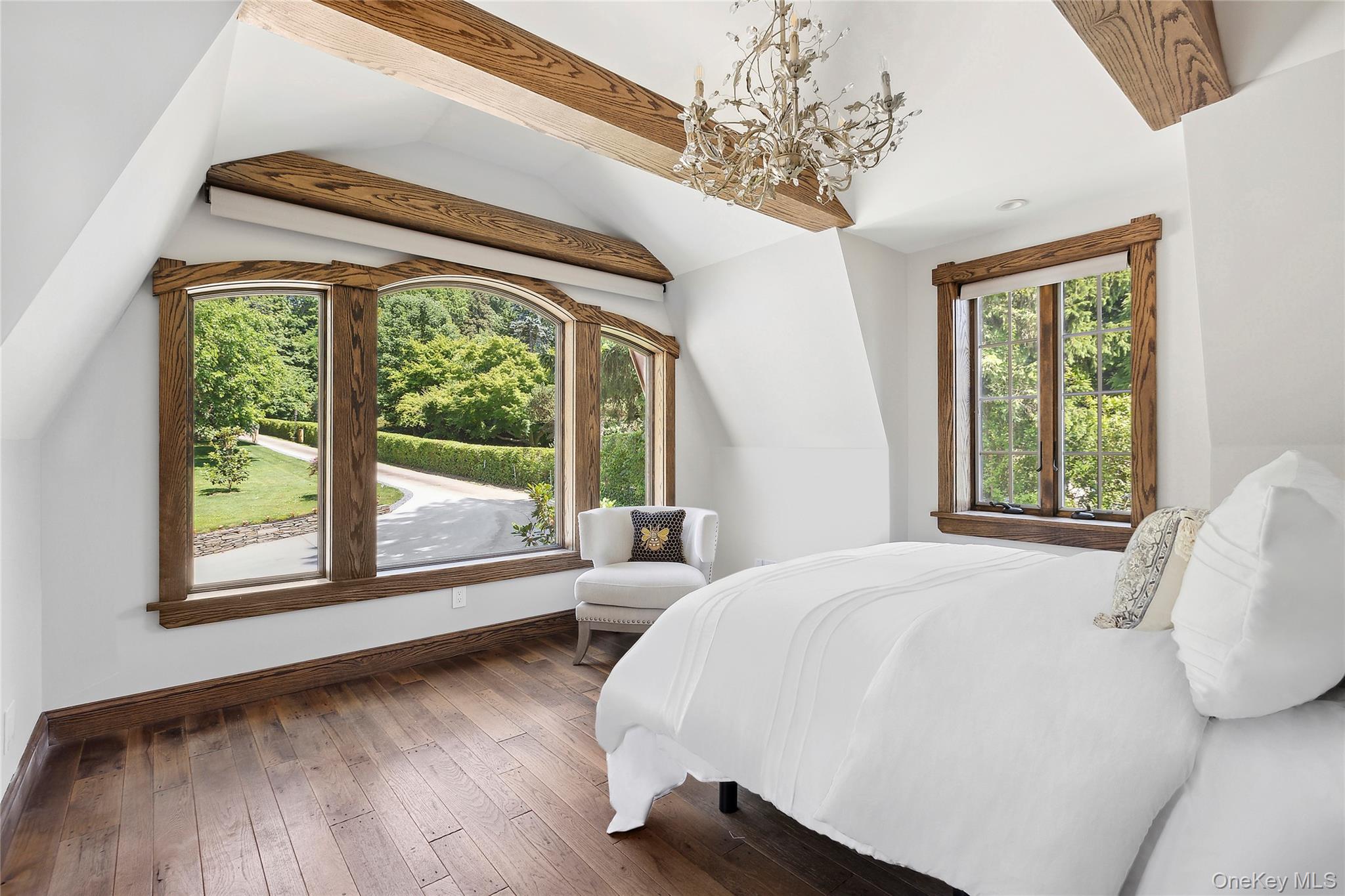 91 Crescent Beach Road Glen Cove, NY 11542 - Photo 28 of 38 a bedroom with a bed and a large window