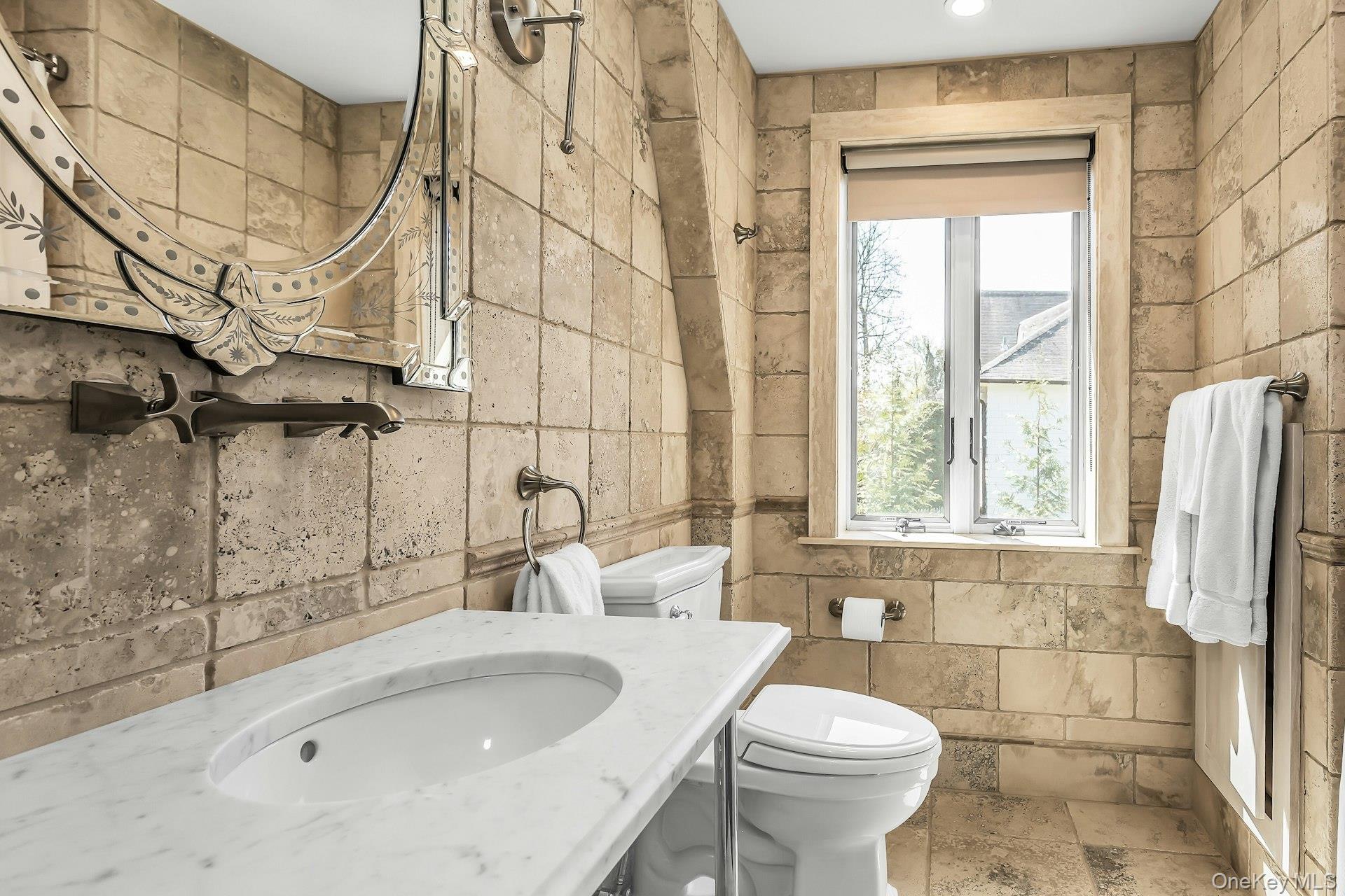 91 Crescent Beach Road Glen Cove, NY 11542 - Photo 30 of 38 a bathroom with a sink a toilet and shower