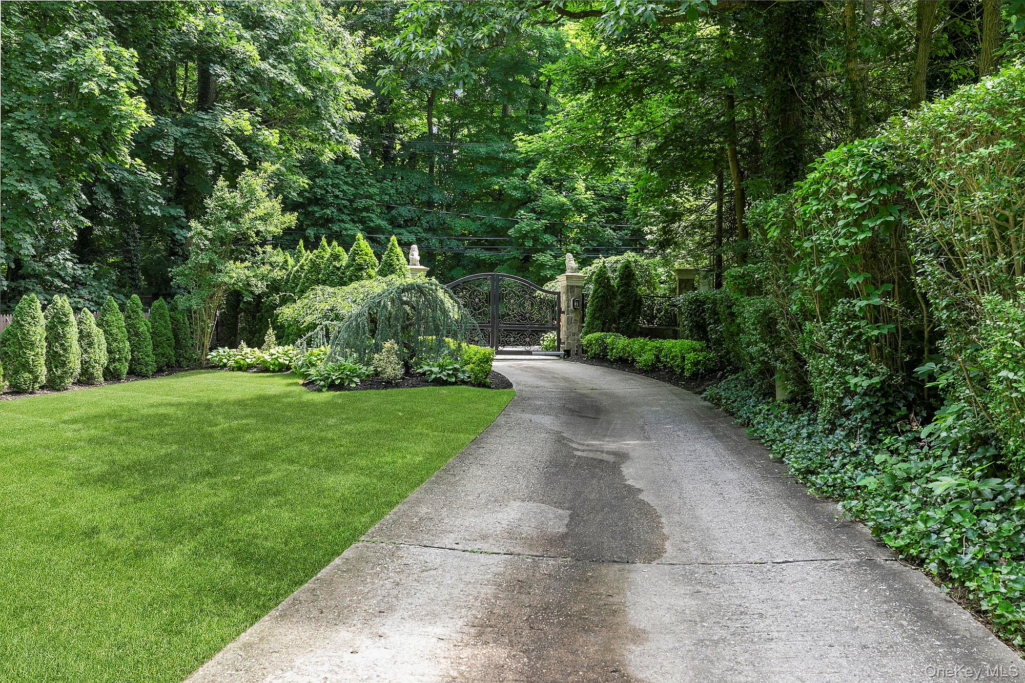 91 Crescent Beach Road Glen Cove, NY 11542 - Photo 35 of 38 a view of a park with large trees