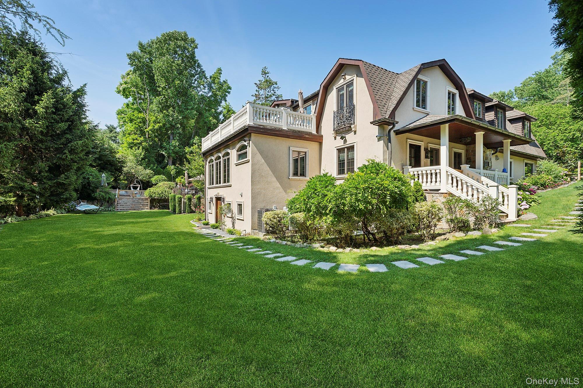 91 Crescent Beach Road Glen Cove, NY 11542 - Photo 36 of 38 a front view of house with yard and green space