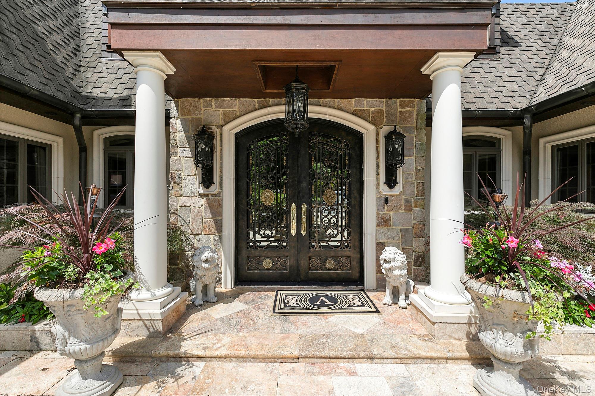 91 Crescent Beach Road Glen Cove, NY 11542 - Photo 4 of 38 a view of a door of the house with potted plants