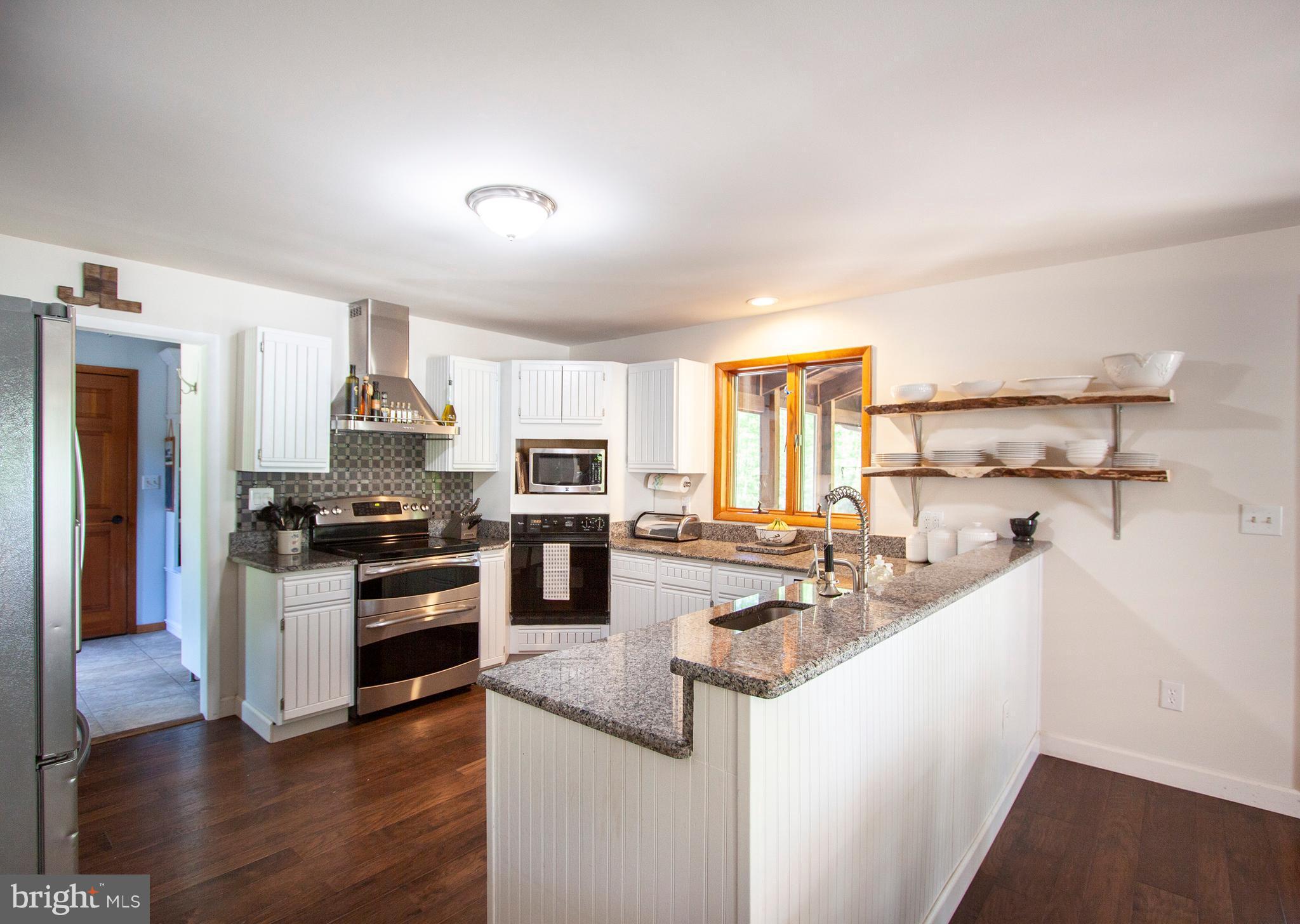 949 Shady Beach Road Elkton, MD 21921 - Photo 14 of 30 warm inviting open kitchen