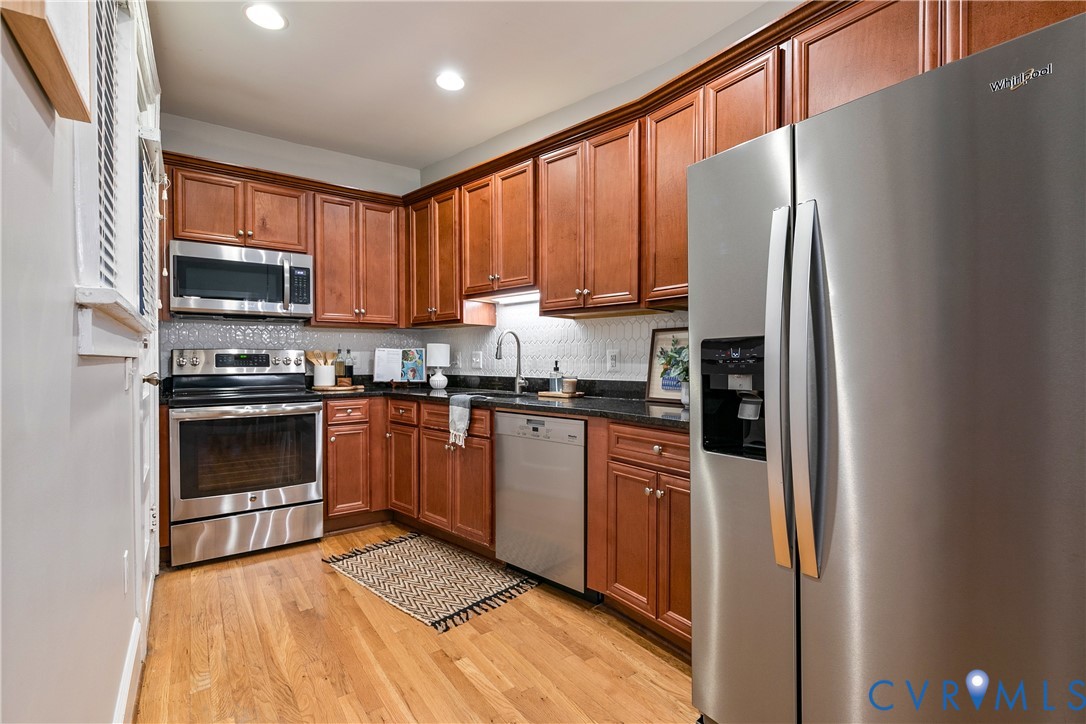 601 Roseneath Road, Unit U1 Richmond, VA 23221 - Photo 12 of 36 Contemporary kitchen featuring wood-finish cabinet