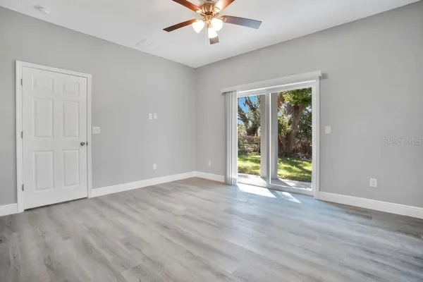 a view of an empty room with a window