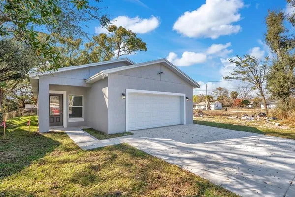 a view of a house with a yard