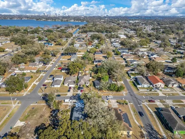 an aerial view of a house with a yard