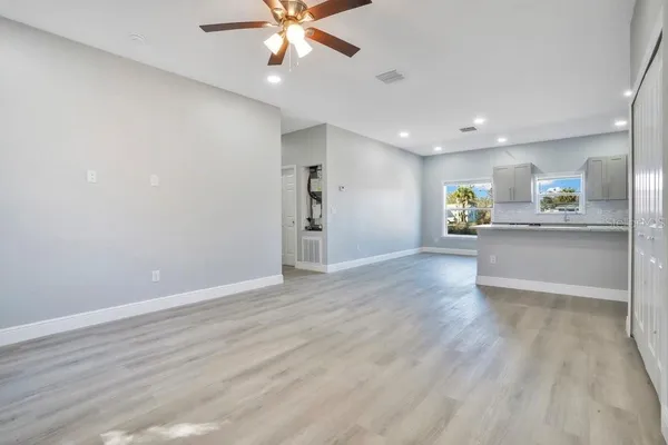 a view of a kitchen with a sink and a stove top oven