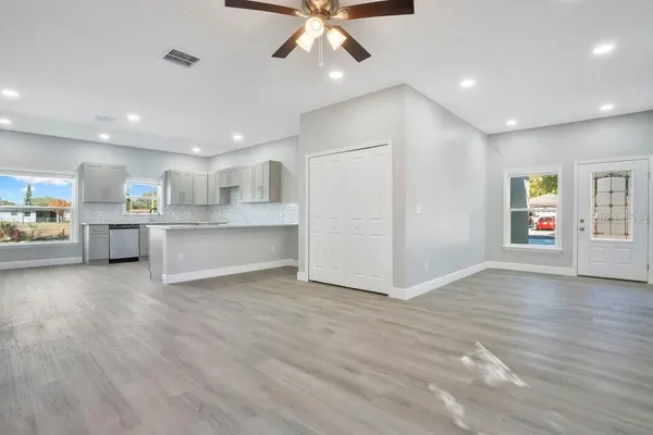 a view of kitchen with wooden floor and window