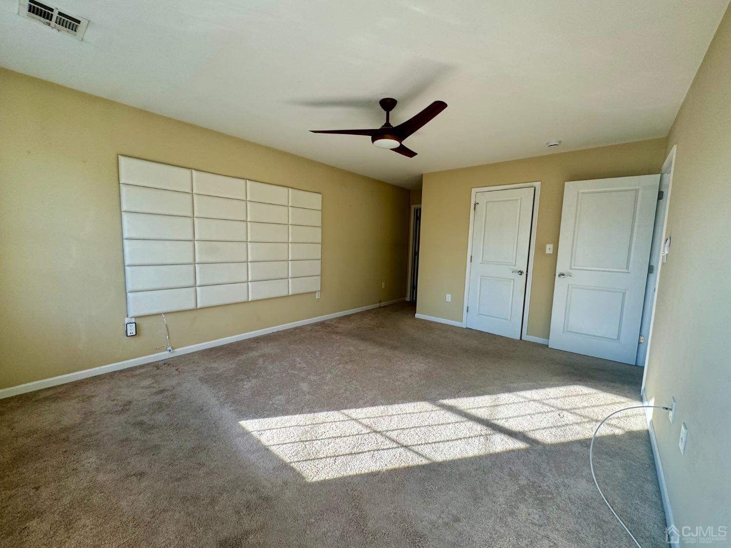 14 Baxter Road Edison, NJ 08817 - Photo 12 of 16 a view of livingroom with an empty space and wooden floor