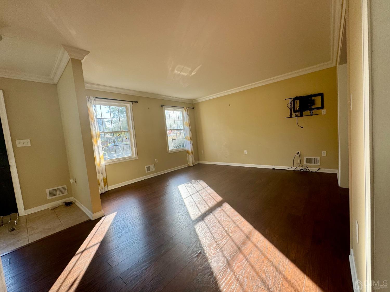 14 Baxter Road Edison, NJ 08817 - Photo 13 of 16 wooden floor in an empty room with a window