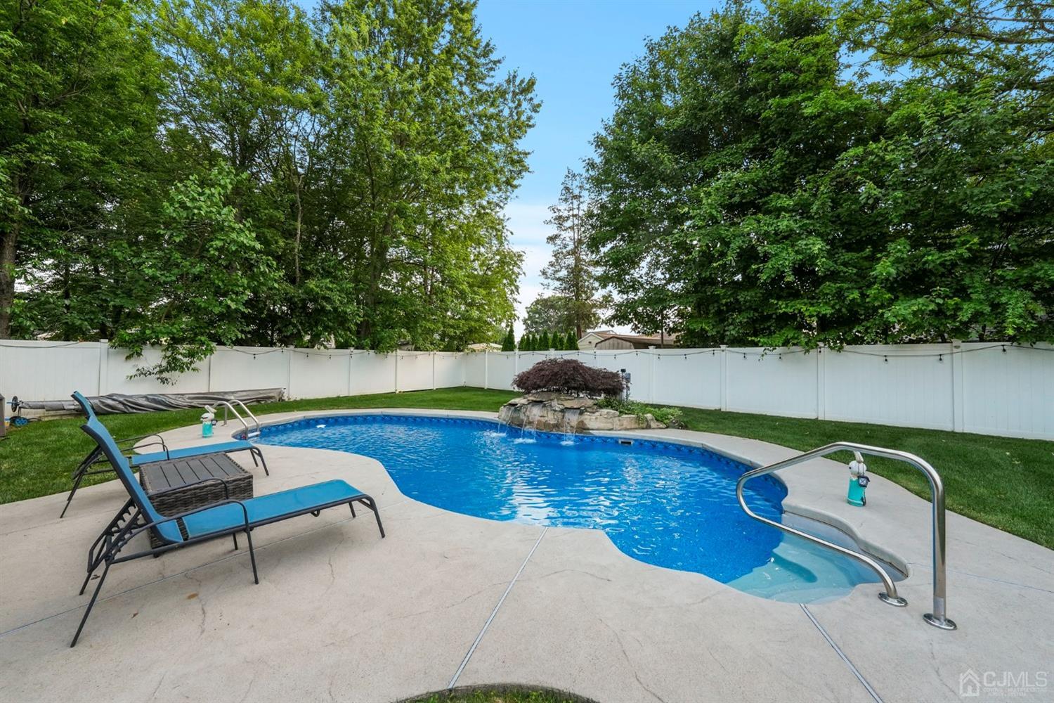 14 Baxter Road Edison, NJ 08817 - Photo 15 of 16 a view of swimming pool with chairs