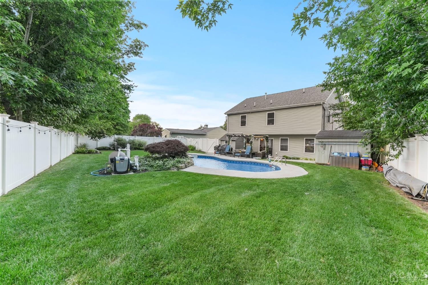 14 Baxter Road Edison, NJ 08817 - Photo 16 of 16 a view of a house with backyard sitting area and garden