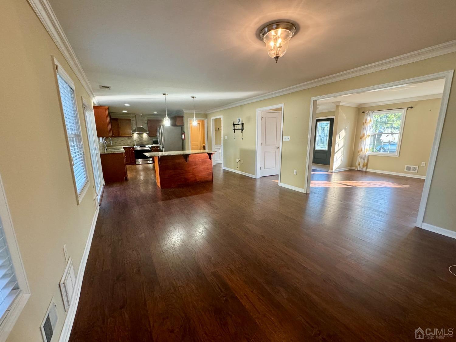 14 Baxter Road Edison, NJ 08817 - Photo 5 of 16 wooden floor in an empty room with a fireplace