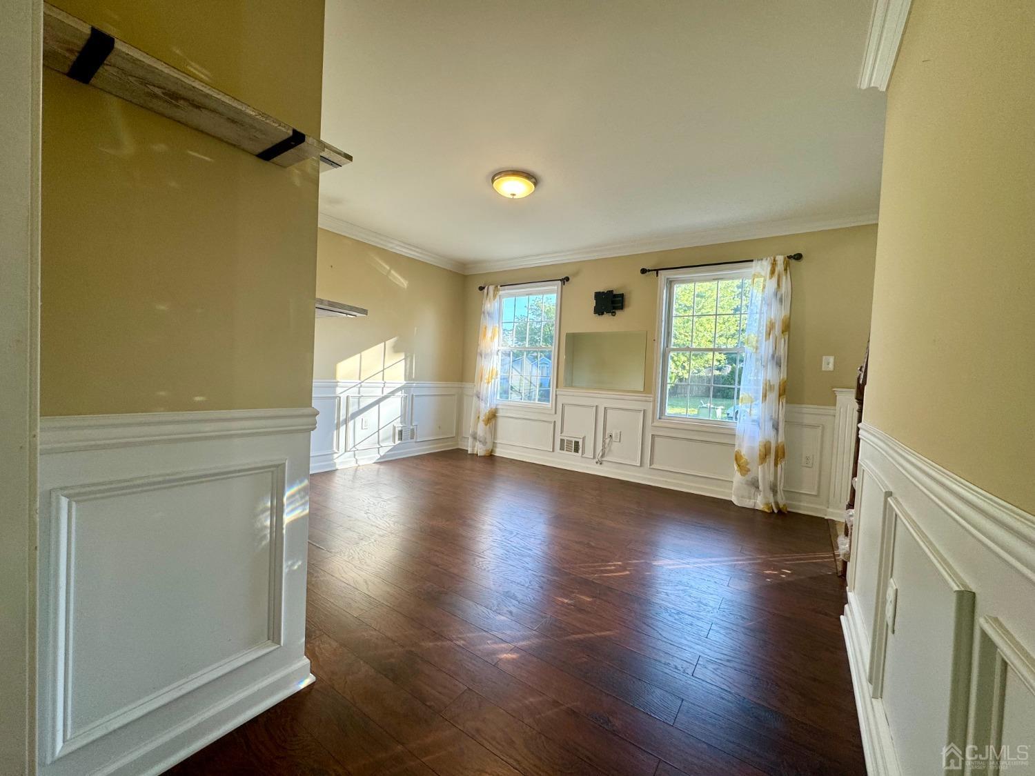 14 Baxter Road Edison, NJ 08817 - Photo 8 of 16 wooden floor in an empty room with a window